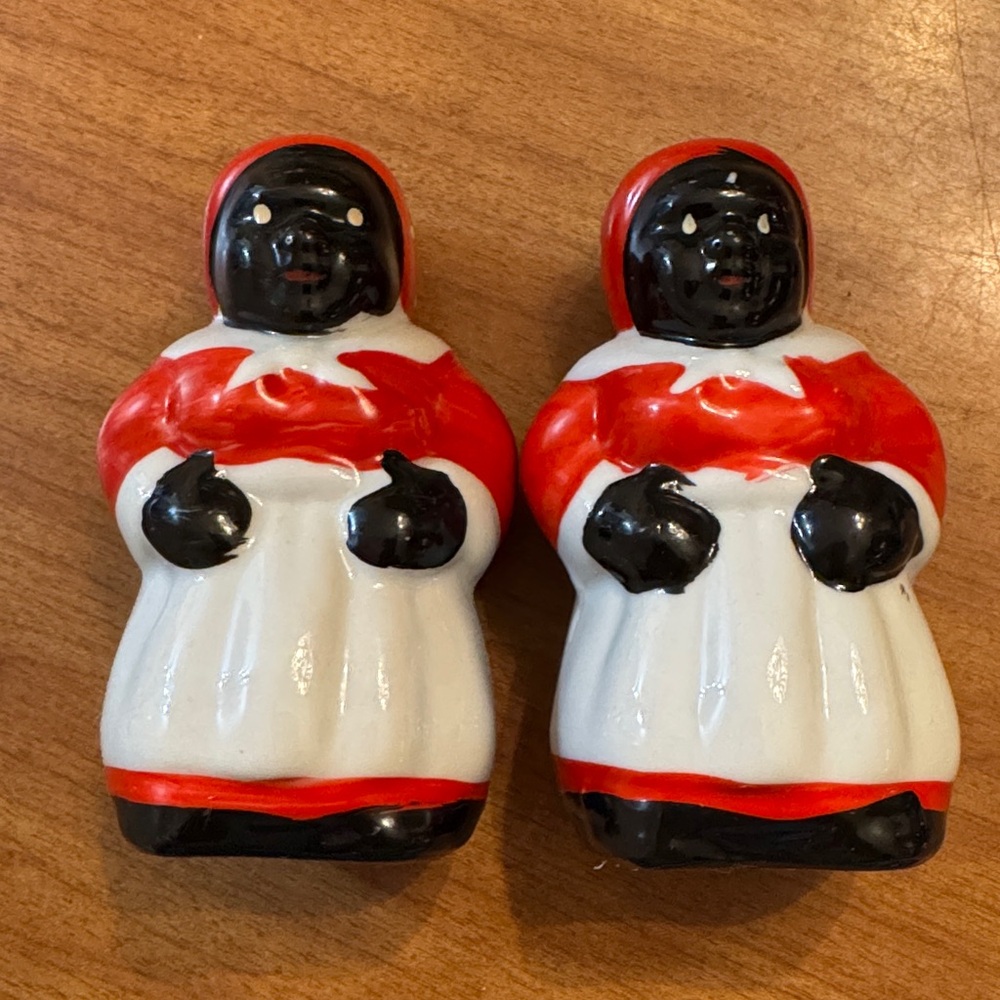 Black americana salt and pepper shaker set. Height ( one stopper missing)